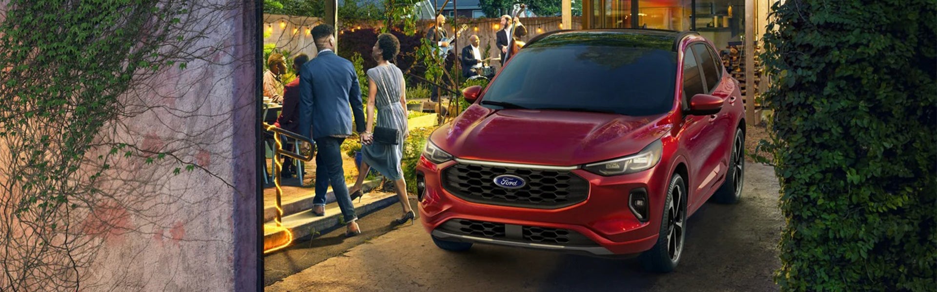 2023 Ford Escape in red parked in a vibrant urban setting